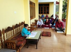 Jets&uuml;n Rinpoche joins members of the Wester sangha during Tibetan reading class